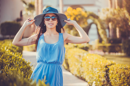 Beautiful young woman in the summer gardenの写真素材