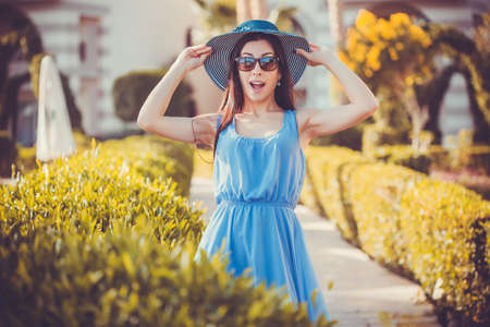 Beautiful young woman in the summer gardenの写真素材