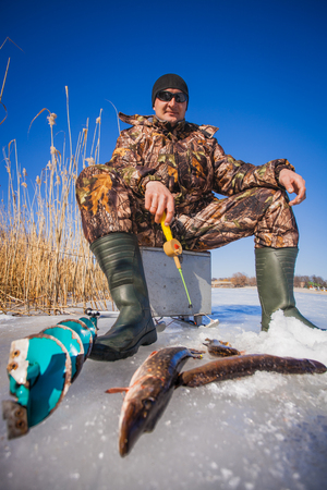 catch pike on winter fishing  on the live baitの写真素材