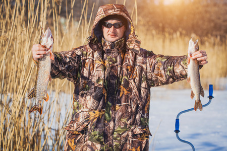 catch pike on winter fishing  on the live baitの写真素材