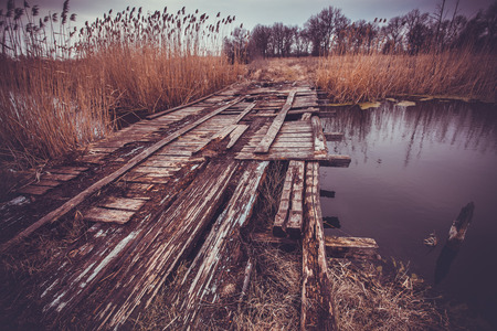 old wooden bridge over the river. landscapeの写真素材