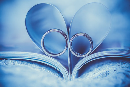 wedding rings in sign of the heartの写真素材