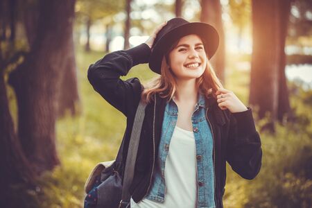 Beautiful girl in the green summer parkの写真素材