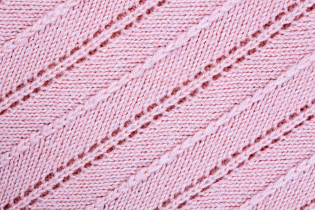Pink knitted fabric background. Color image.