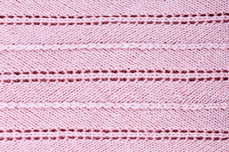 Pink knitted fabric background. Color image.の写真素材