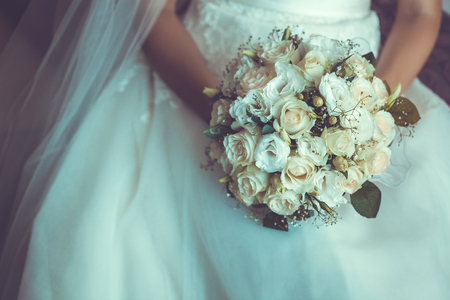Bride in White Dress Holding Splendid Bridal Boquet Colorfulの写真素材