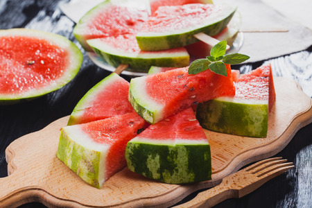 Top view.healthy watermelon on the black wooden background.の写真素材