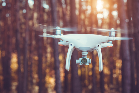 drone quadrocopter with digital camera in the forestの写真素材