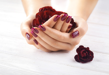 beautiful vinous manicure with rose flowers. spaの写真素材