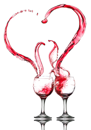 Two glasses of red wine. Heart Splash. Isolated on the whiteの写真素材