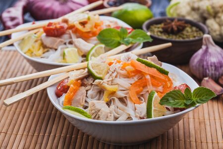delicious Korean rice noodles with chicken.の写真素材