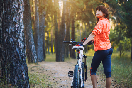 cyclist cycling mountain bike on Pine forest trailの写真素材