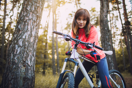 cyclist cycling mountain bike on Pine forest trailの写真素材