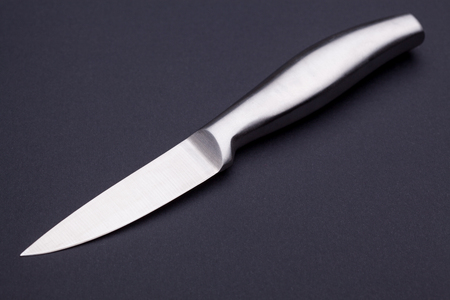 steel kitchen knife on the blackの写真素材