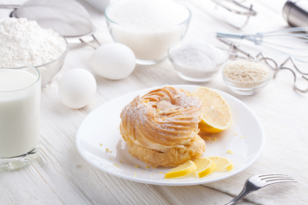 Ingredients for baking delicious cakes on a white wooden tableの写真素材