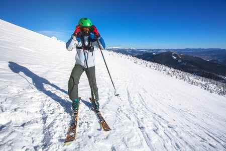 Man skier on a slope in the mountainsの写真素材