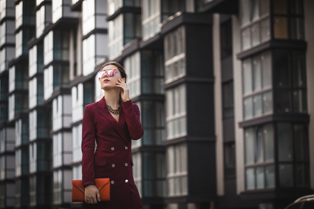 Business woman walking outside in cityの写真素材