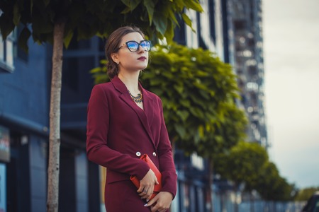 Business woman walking outside in cityの写真素材