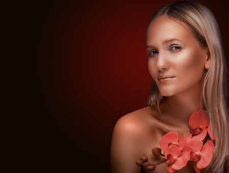 portrait of a girl. Golden shining makeup on the dark backgroundの写真素材