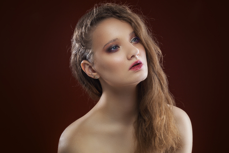 portrait of a girl. day make-up on the dark backgroundの写真素材