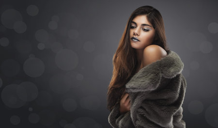 beauty womans portrait. evening make-up on the gray bokeh backgroundの写真素材