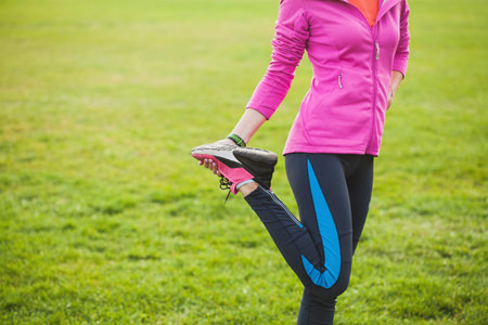 woman athlete warm-up at the stadium. active lifestyle