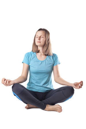 young woman doing yoga. studio photoの写真素材