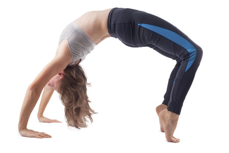 young woman doing yoga. studio photoの写真素材