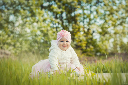 little girl on a blooming spring meadowの写真素材