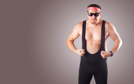 man in sports tights, sunglasses and headband on aの写真素材
