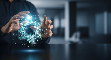 A persons hands cupping a luminous abstract digital structure symbolizing innovation data science and the future of business technology in a modern office setting.の素材