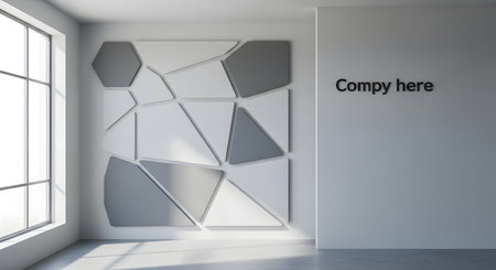 A contemporary room featuring a striking geometric acoustic wall panel with a mix of grey and white shapes, illuminated by natural light from a large window.の素材