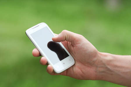 Man holding a smart phoneの写真素材