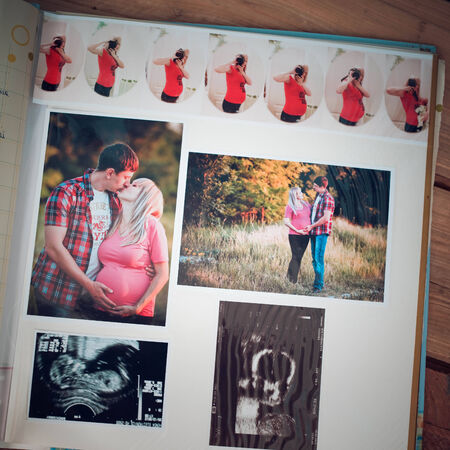 Photo album with family photos during pregnancyの写真素材