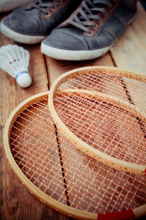 Vintage wood tennis racket on aged woodenの写真素材