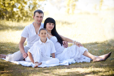 young family with a sun on the natureの写真素材