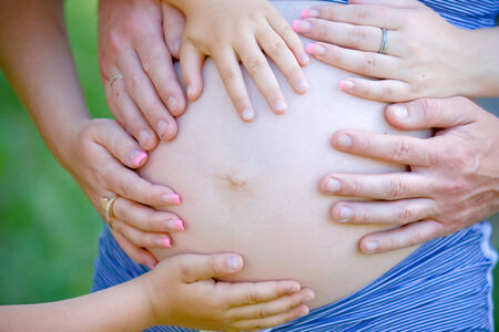 hand on pregnant womanの写真素材