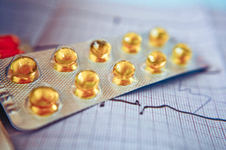 pills and capsules on the cardiogram