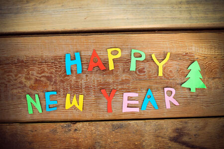 Happy New Year text  on wood backgroundの写真素材