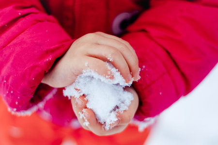 Snow in the child is hands