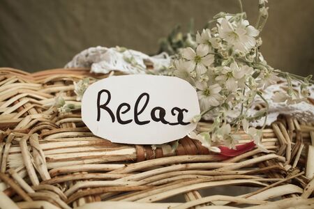 Tag with text relax on the white flowersの写真素材