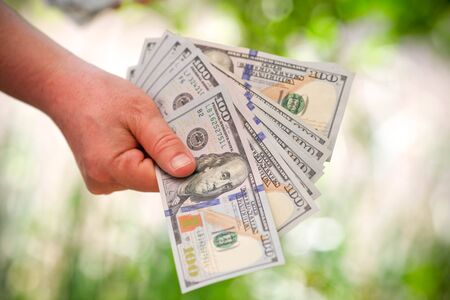 dollars bills in handの写真素材