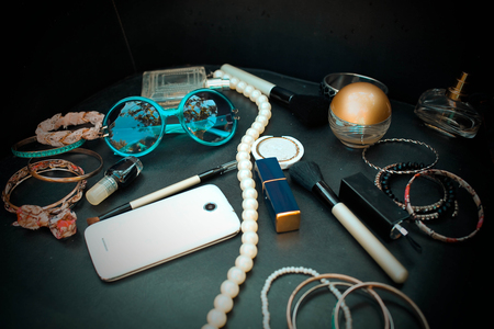 Female accessories and cosmetics on a black backgroundの写真素材