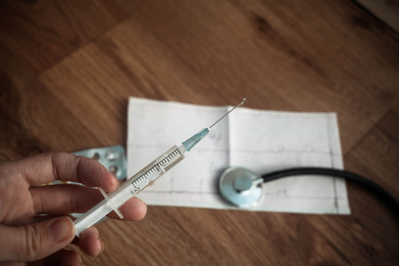 Medical equipment : stethoscope, ampules and syringeの写真素材