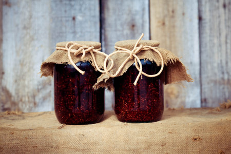 Fresh raspberry jam in a glass jarの写真素材