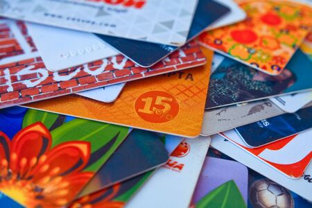 bright plastic discount cards closeup. market background. selective focus.の写真素材