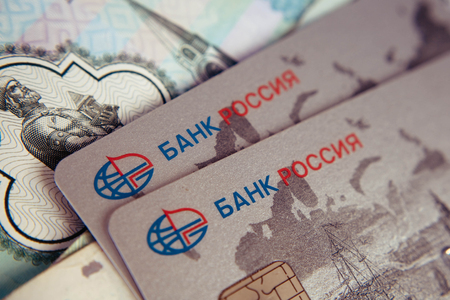 SEVASTOPOL, RUSSIA - on  FEBRUARY 23,2016: Credit card of Crimean bank Russia and Russian rubles / partially out of focus, focus on Russia card. Illustrative editorial.のeditorial素材