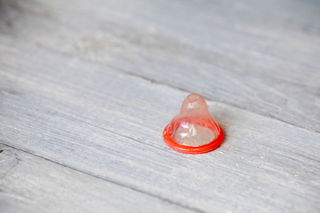 Condom Case on white wooden background , save sex, Space for text.の写真素材