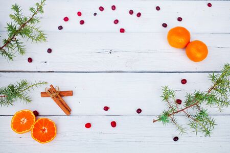 Christmas  food decor and fir tree branch on wooden table. Top view with copy spaceの写真素材