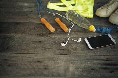 A set for sports activities on wooden background with copyspaceの写真素材